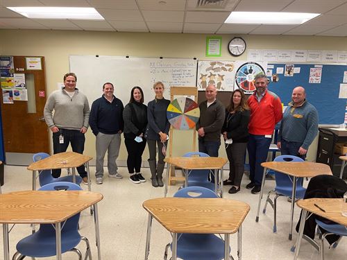 A department group photo in a classroom